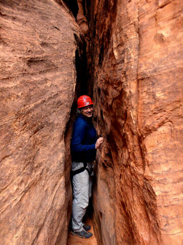 Your tour guide squeezing through one of the many narrow sections.
