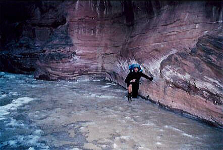 Trying to break through the ice at the mouth of Buckskin Gulch.