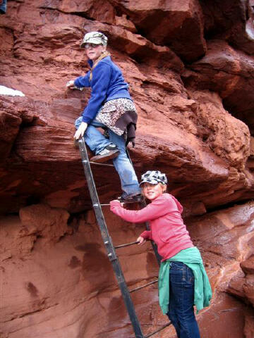 Bri and Sierra climbing the ladder