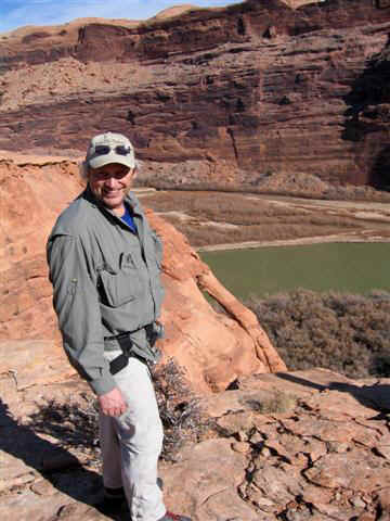 Your tour guide with arch and Colorado River.