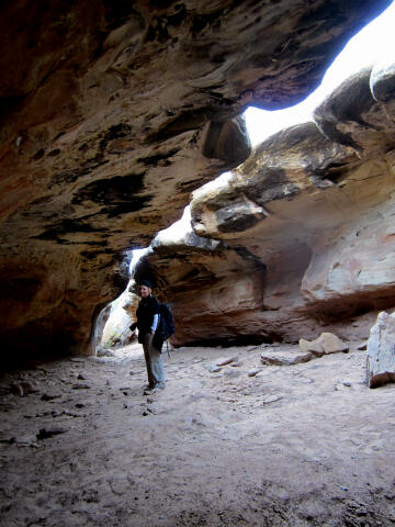 Shauna inside the grotto admiring the rock art.