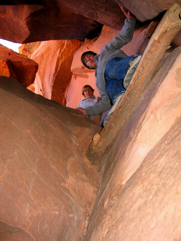 Kasey and Josh climb the log ladder.