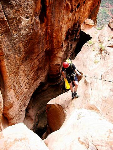 Kip Marshall Rappels into the final narrows of Spry Canyon