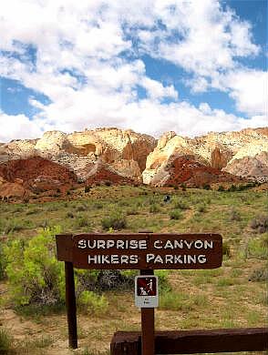 Sign pointing to Surprise Canyon in the background.