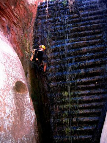 Marc Olivares rappels the log dam.