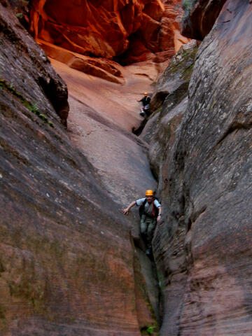 Downclimbing the curling V-slot section.